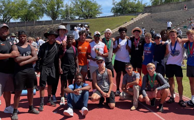 Photo submitted The Hart County boys’ track and field team poses for a photo with its third-place state trophy in Albany. Pictured from left to right are, top row, assistant coach Kendell Rucker, Trez Fouch, Jesse Chlenker, Justin Coker, Quinn Moore, Ty Shiflet, head coach Floyd Ramsey, Damian “D-Rock” Tyler, Kanye Fouch, J.C. Curry, Dominic Dutton, Cole Risner, A.J. Johnson, Chandler Smith, assistant coach Tevin Glaze, bottom row, Johnny Curry, Andrew Brezeale, Diego Martinez and Zachary Peters.