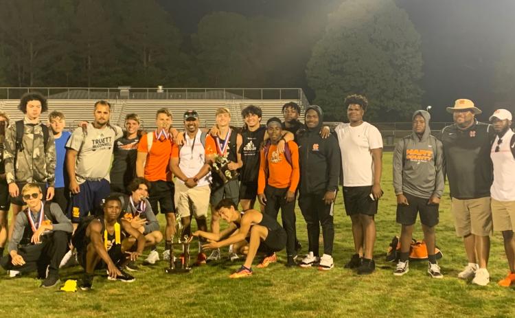 Photo submitted The Hart County High School boys’ track team is pictured with the Region 8-AAA trophy after taking the title in Monroe last week.