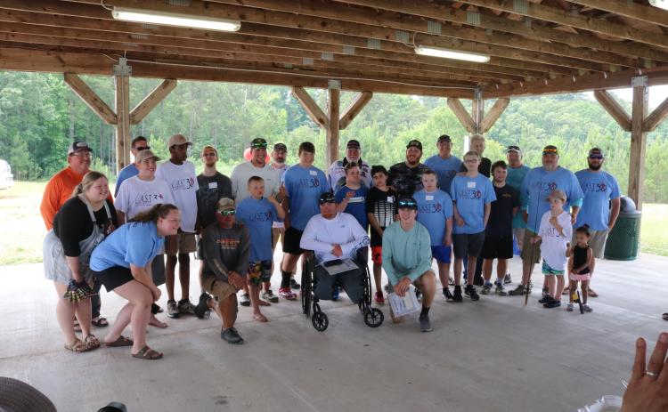 Sunshot by Grayson Williams - Participants and volunteers for Lake Hartwell’s first-ever CAST for Kids event pose for a photo after an awards ceremony on Saturday, June 6 at Gum Branch Mega Ramp in Hartwell.