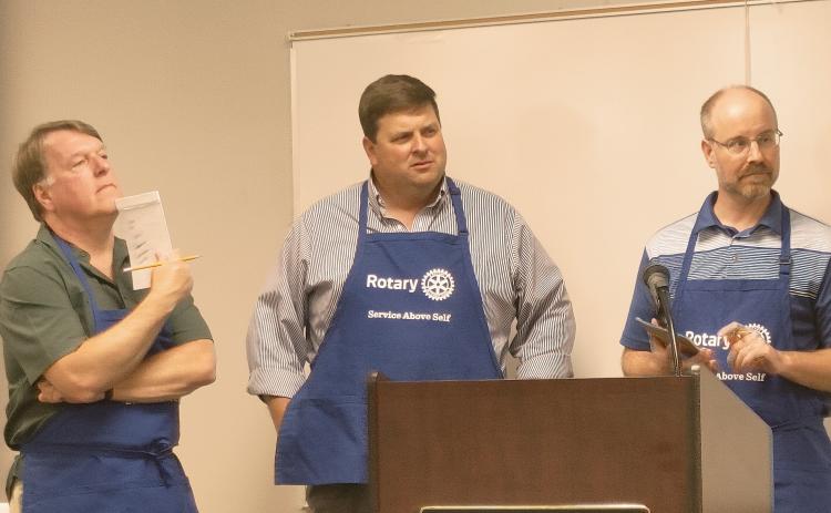 Dan Hunt/The Hartwell Sun - Jon Herschell and Brian Metzger from the Rotary spelling bee team listen to their next word assignment at the Hart County Adult Learning Center on June 17.