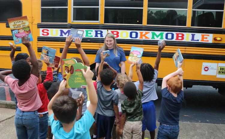 Grayson Williams/The Hartwell Sun - A crowd of students line up at Hart County Headstart on Richardson Street on June 8 to receive free books from the annual Summer Bookmobile put on by Hart Partners.