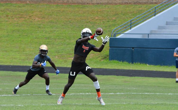 Drew Dotson/The Hartwell Sun - Paul Davis catches a pass in the semi-finals of the 7-on-7 camp in Cleveland against St. Pius X Catholic School.