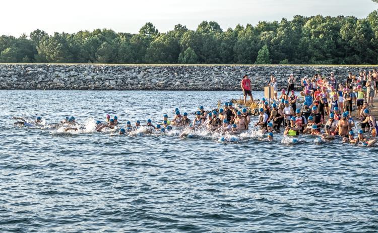 Bill Powell/The Hartwell Sun - Triathletes jump in at Big Oaks  Recreation Area on Lake Hartwell.