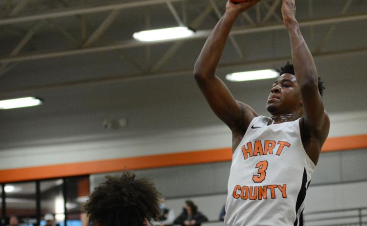 From File - Tahj Johnson pulls up for the jump shot against Cherokee Bluff on Feb. 27, 2021.