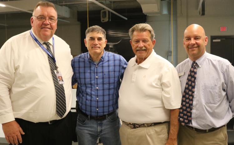 Photo submitted Pictured left to right: Hart County superintendant Jay Floyd, Congressman Andrew Clyde, Ga. Rep. Alan Powell and Career Academy CEO Brooks Mewborn pose for a photo at the  Hart College and Career Academy.