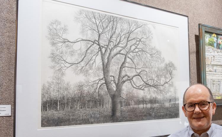 Bill Powell/The Hartwell Sun - William Livesay displays his Best in Show-winning work, Trees in a Pasture at last week’s Juried Art Exhibit.