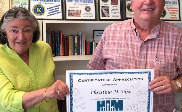 Christina Silpe, left, is handed a certificate of appreciation by Reverend Edwin Simmons for her years of service to Hart Interdenominational Ministry.