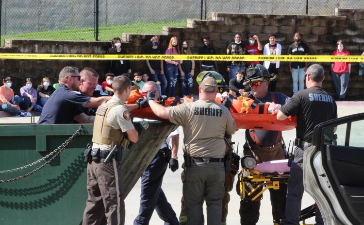 Photo submitted - Detectives, firefighters, officers, coroners and more reenact a crime scene at Hart County High School on Monday, shocking students in a literature class, whose teacher was in on the scheme.