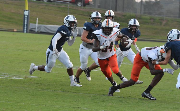 Running back JL Lackey follows his blocks to rack up 200 yards on Hart County’s win over White County on Aug. 26.