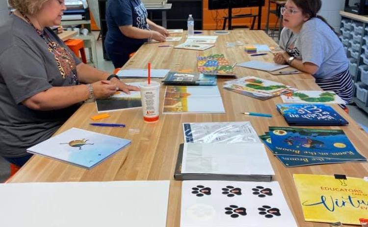 Oglesby and her team of StoryWalk creaters hard at work creating books for Hart County.