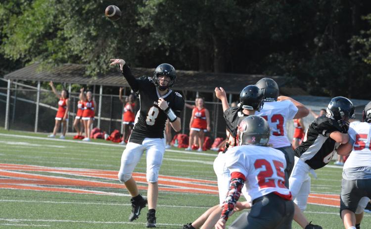 Quarterback Brice Williamson throws a pass against Madison County Middle School on Thursday, Sept. 9.