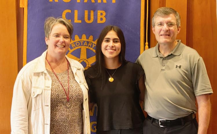 GRSP student and Colombian-native Catalina Velez Aristizabal stands alongside her Hartwell hosts Marcie and Joe Garringer.