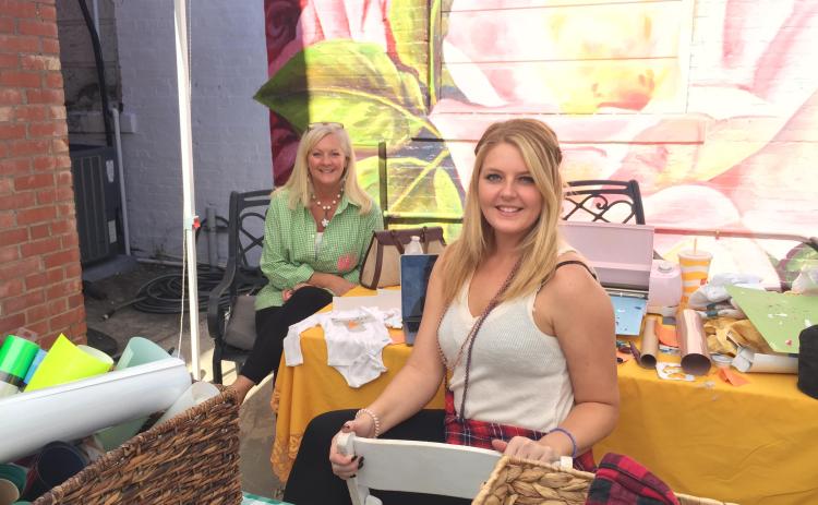 Amelia and Alexis Hays show off their fashion line at the Hartwell Makers Festival.