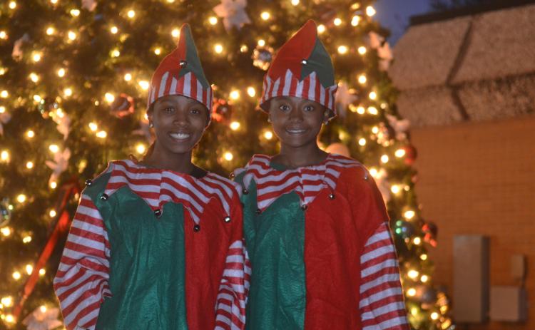 Sisters Trinity (left) and Morgan Carter Freeman (right) smiling as bright as the Hartwell Christmas tree at the town’s annual tree lighting ceremony held Monday, Nov. 22.