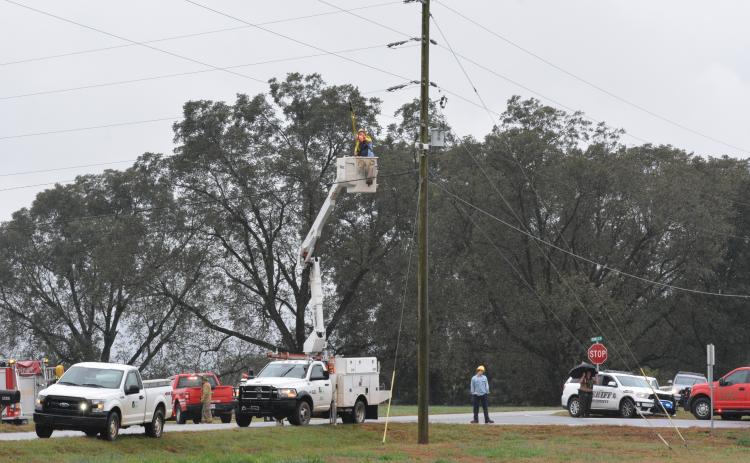 A technician fixes a power line moments after it was entangled with a boom truck, causing a man to be electrocuted.