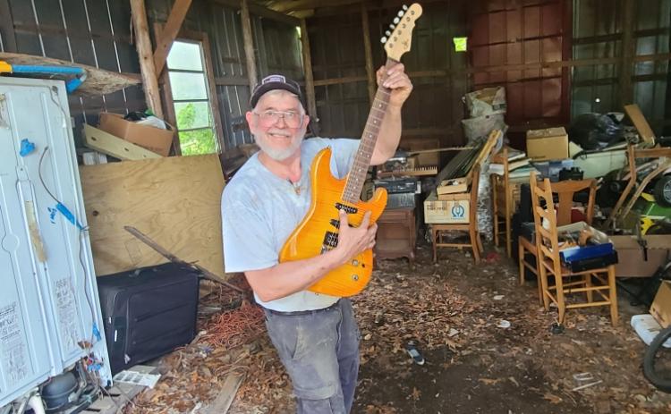 Photo submitted In his retirement, amall engines mechanic Johnny Segers enjoys picking up old hobbies like playing guitar.
