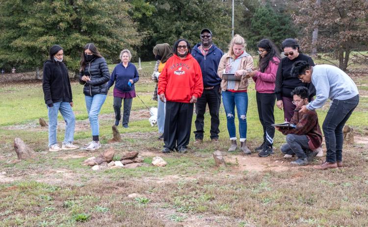 From left to right, Kassadi Saunders, Sara Castro, Ellen Davenport, Zainab Saccoh, Diane Merritt, Howard Curry, Emily Dukes, Pooja Bangera, Rosanna Cruz-Bibb, Aries Aviles, and Flavio Salgedo Avila. The team was assembled to research the grave site outside Harmony Grove Baptist Church in an attempt to add it to the National Historic Register.