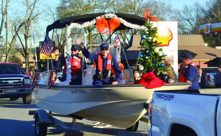 The U.S. Coast Guard Auxiliary makes its way through town as part of the 2021 Christmas parade in Hartwell.