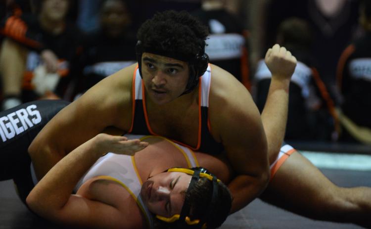 Quanterrio Hyman looks to referee for the pin against his Crescent opponent on Wednesday, Dec. 15.