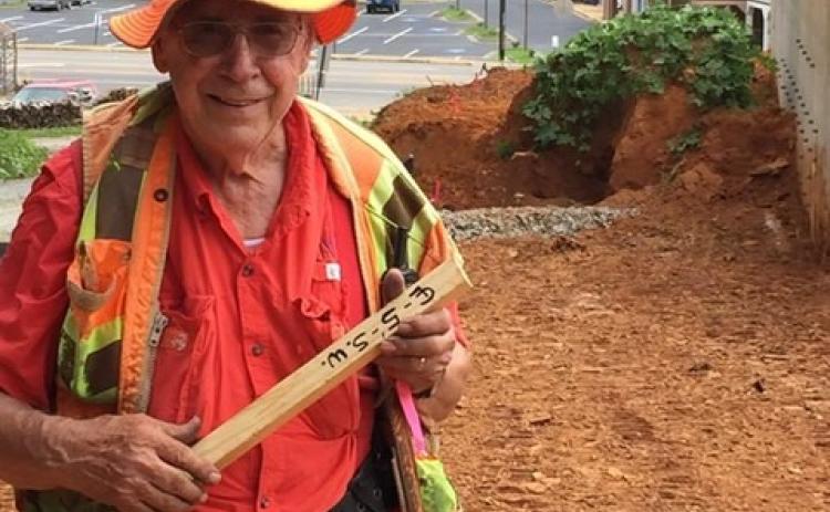 Teasley hard at work doing what he loves as the county surveyor.