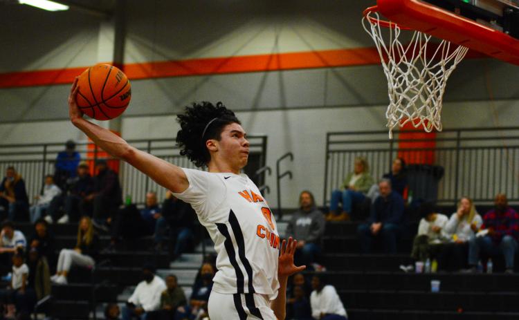 Senior Johnny Curry slams down in the 78-46 win over East Jackson on Friday night.