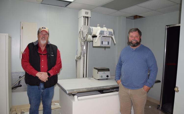 Jerry “Scoot” Rice and Scott Bailey are donating X-ray machine equipment left in the former medical building they are turning into a storage facility.