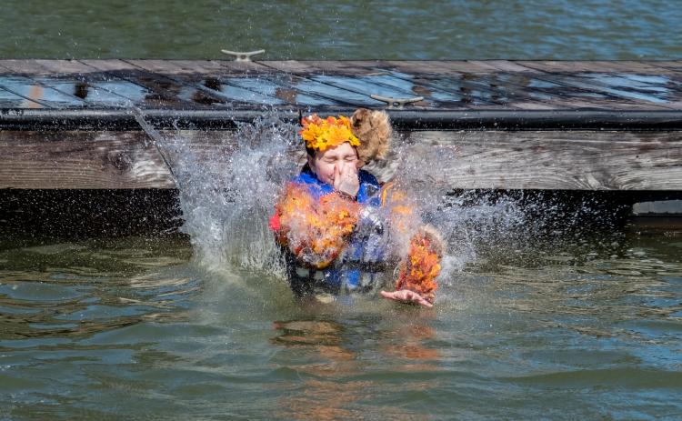 A participant takes the plunge at the 2020 Polar Bear Plunge. The annual event is returning in full capacity this year after going virtual in 2021.