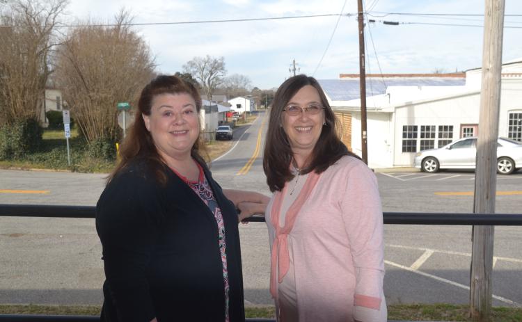 Dan Hunt/The Hartwell Sun - Women Build ambassador Michelle Wetherbee, left, alongside Hart County Habitat director Darlene Nixon, right.