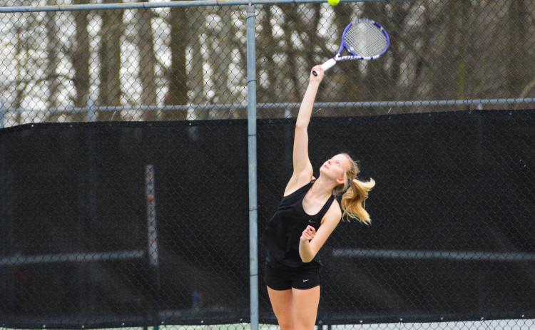 Ava Carnes serves in her win over Elbert County.