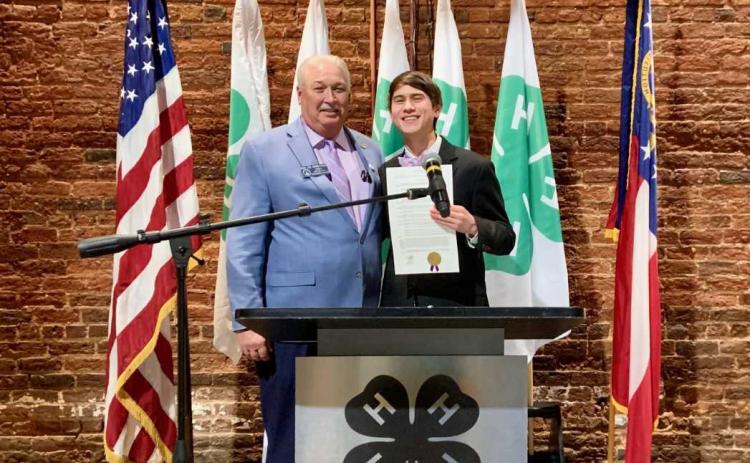 Senator Lee Anderson presenting Ben Tellano with the Senate proclamation.