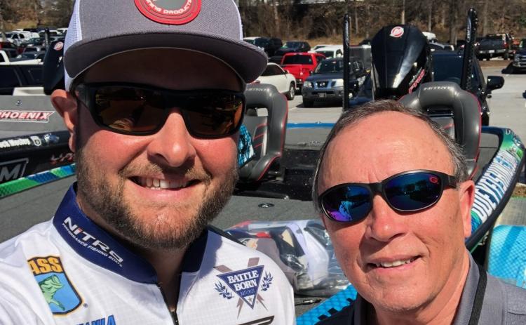 Local fisherman and Bassmaster Classic marshal David McGinnis, right, with his new friend and rising star angler Joey Nania.