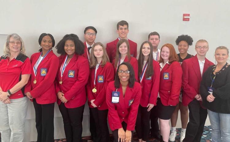 Pictured from left to right are, back row, Ethan Ho, Jonathan McClain, Ivan Martin, Louiesa Gibbs, middle row, Advisor Ms. Vicky Carter, Terriah Bush, Zion Lackey, Bella Chapman, Anna Hunt, Georgia Tucker, Savana Kotal, Sawyer Boyd, Advisor Erica Robertson and, front row, Arionya Gude.