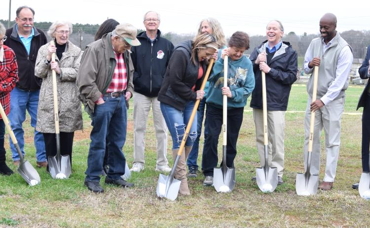 Northeast Georgia Animal Shelter board members, staff and supporters celebrate the groundbreaking for its new building Thursday afternoon.