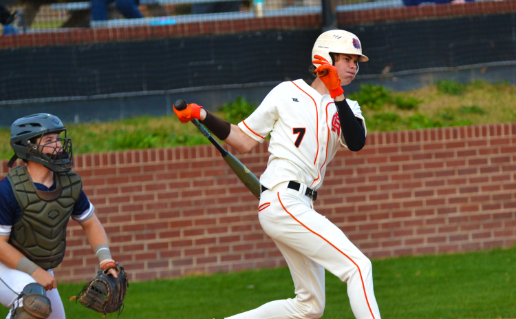 Tanner Ayers gets a hit in the home win against East Jackson on March 22.