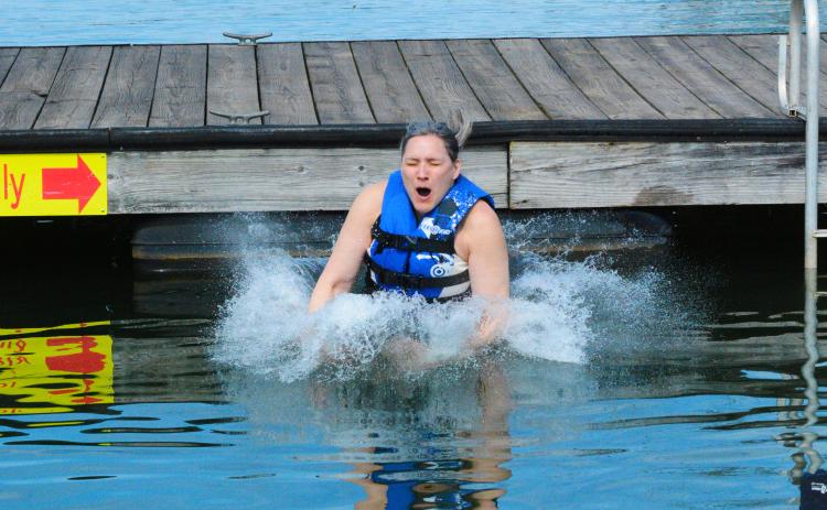 Jodi Simmons braves the chilly Lake Hartwell water for the first time on Saturday.