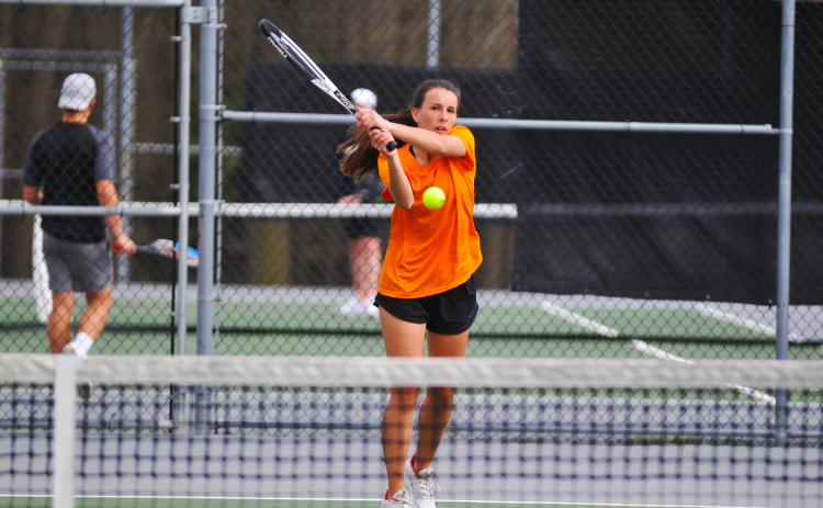 Ryleigh Jordan return a shot in her win against Monroe Area.