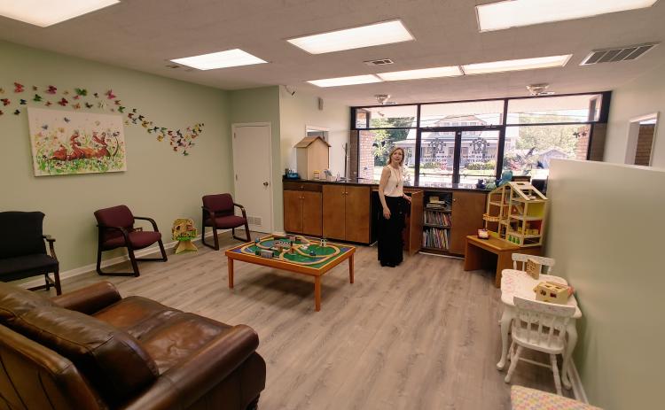 Harmony House CEO Laurie Whitworth inside the playroom and child center on site.