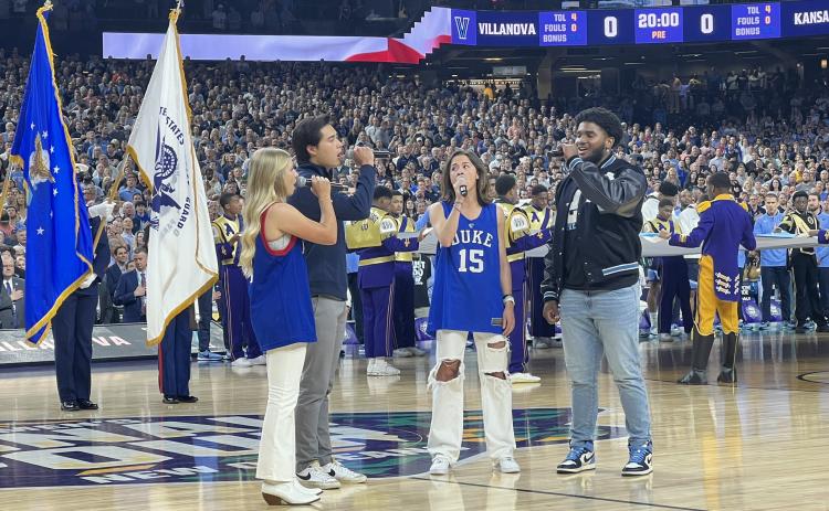 Former Hart County High School student athlete and current North Carolina Tar Heel linebacker Kaimon Rucker (far right) joins his peers from Duke University, Villanova University and Kansas University in a rendition of the national anthem before the men’s basketball Final Four in New Orleans on Saturday.