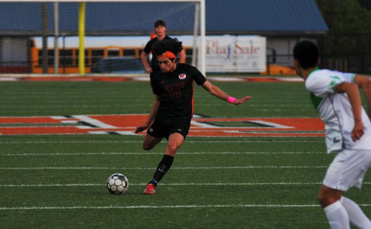 Tyler Trujillo scores a goal on a free kick earlier this season.