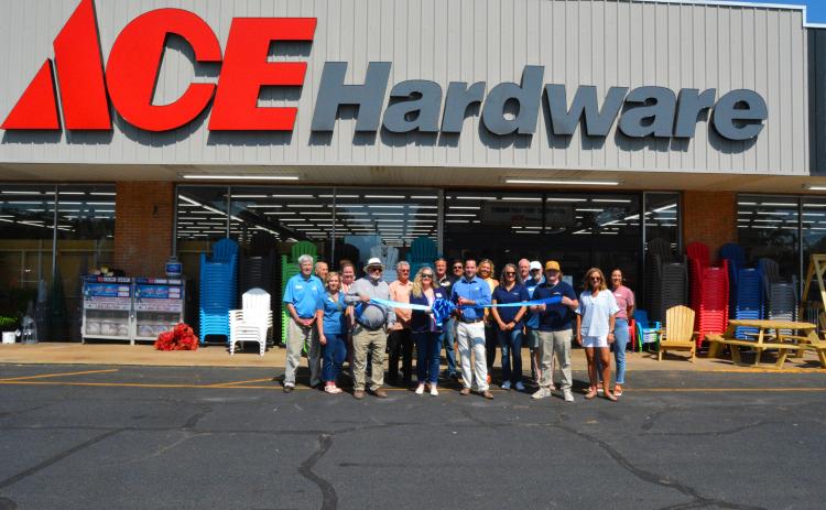 Community members meet for a ribbon cutting at Ace.