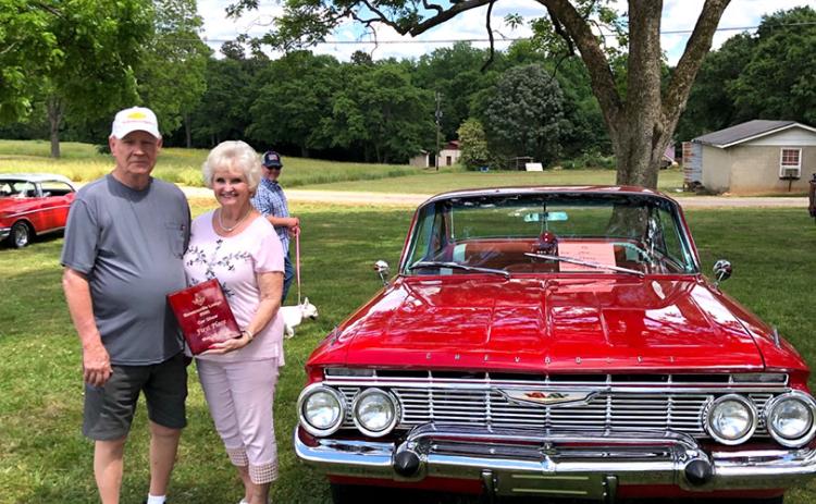 Sammy Bowers and his first place-finishing 1961 Chevy Impala.