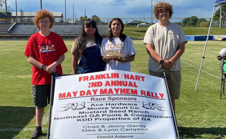Pictured are crew members Brody McDuffie, Aimee Aguilar, Gelsey Aguilar (driver), and Duncan McDuffie (crew chief).