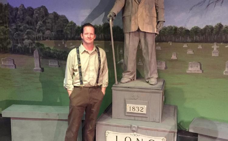 Hartwell playwrite Michael Blackston alongside the prop statue and subject of his original production, “Mr. Long said Nothing.” Blackton’s play, performed by the Hart County Community Theatre, will be available to audiences starting May 13 and run four more nights through May 22.