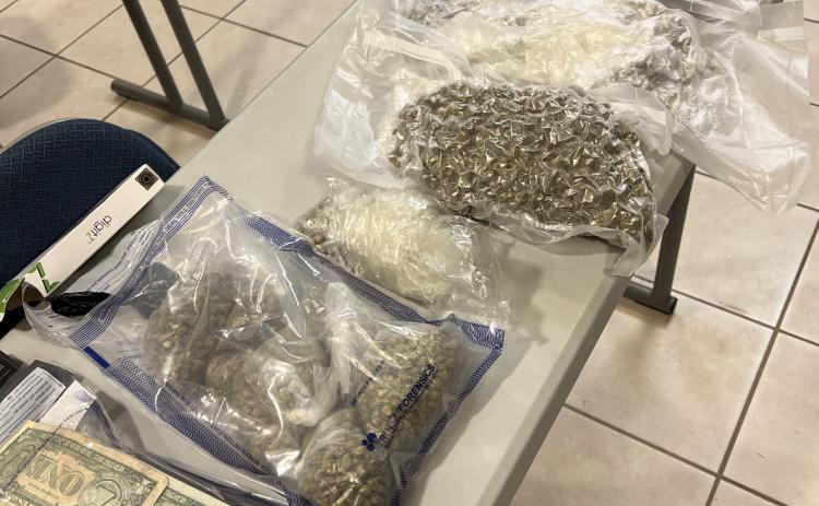 The sheriff’s office recovered a large amount of drugs and cash, pictured above, following a chase through Hart County.
