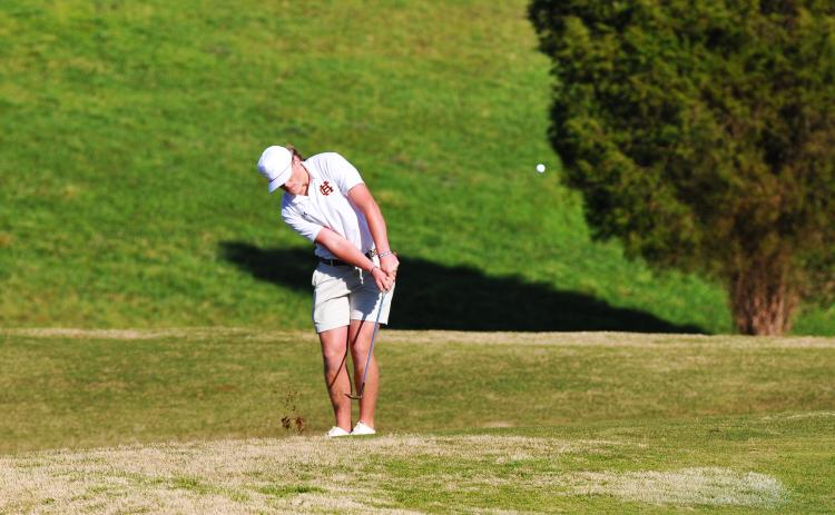 Kip Phillips takes a chip shot in a match against Oconee County earlier this season.