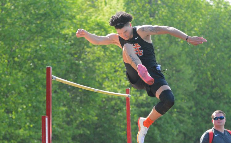 Johnny Curry clears a high jump attempt at the home meet on April 21.