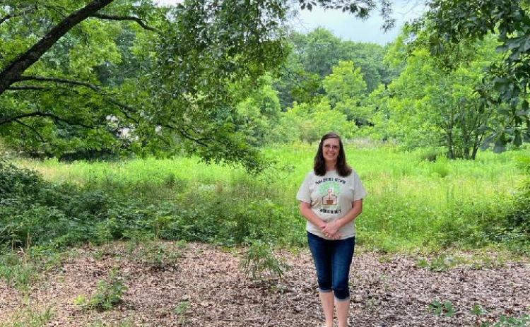 Habitat director Darlene Nixon stands at the site of the planned community garden at the corner of Peachtree and Rose Streets in the Rome and Richardson neighborhood.