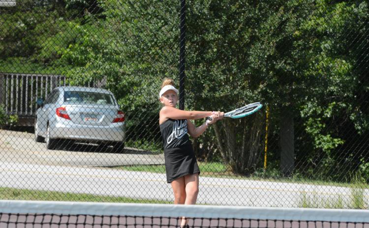Posie Phillips receives private lessons with Kristen Summers to refine her skills.