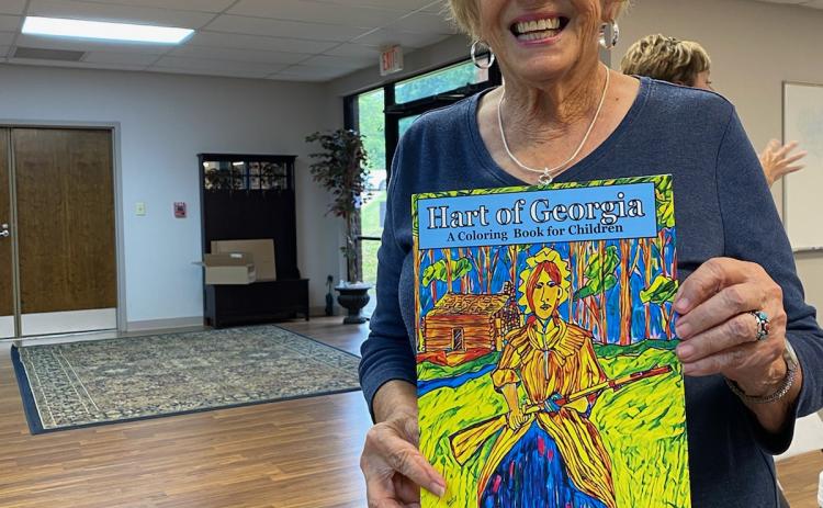 Kay Cleveland shows off her coloring book, which serves as a map of historical places in Hartwell.