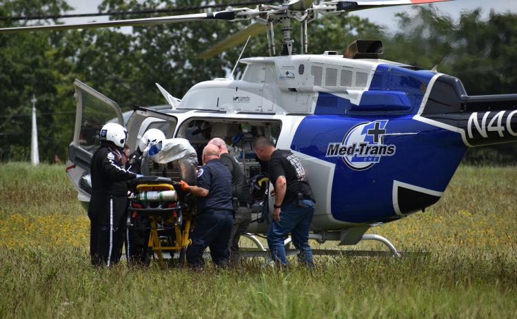 EMS carefully loads burn victim Grayson Webb into an emergency helicopter Tuesday.